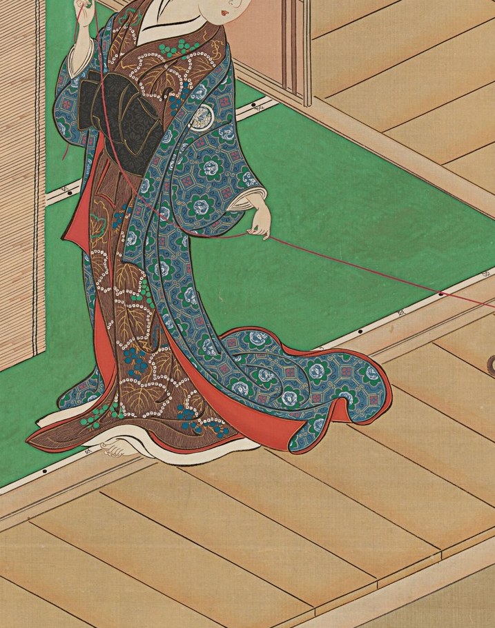 The courtesan, more reserved, holds something in her hand.