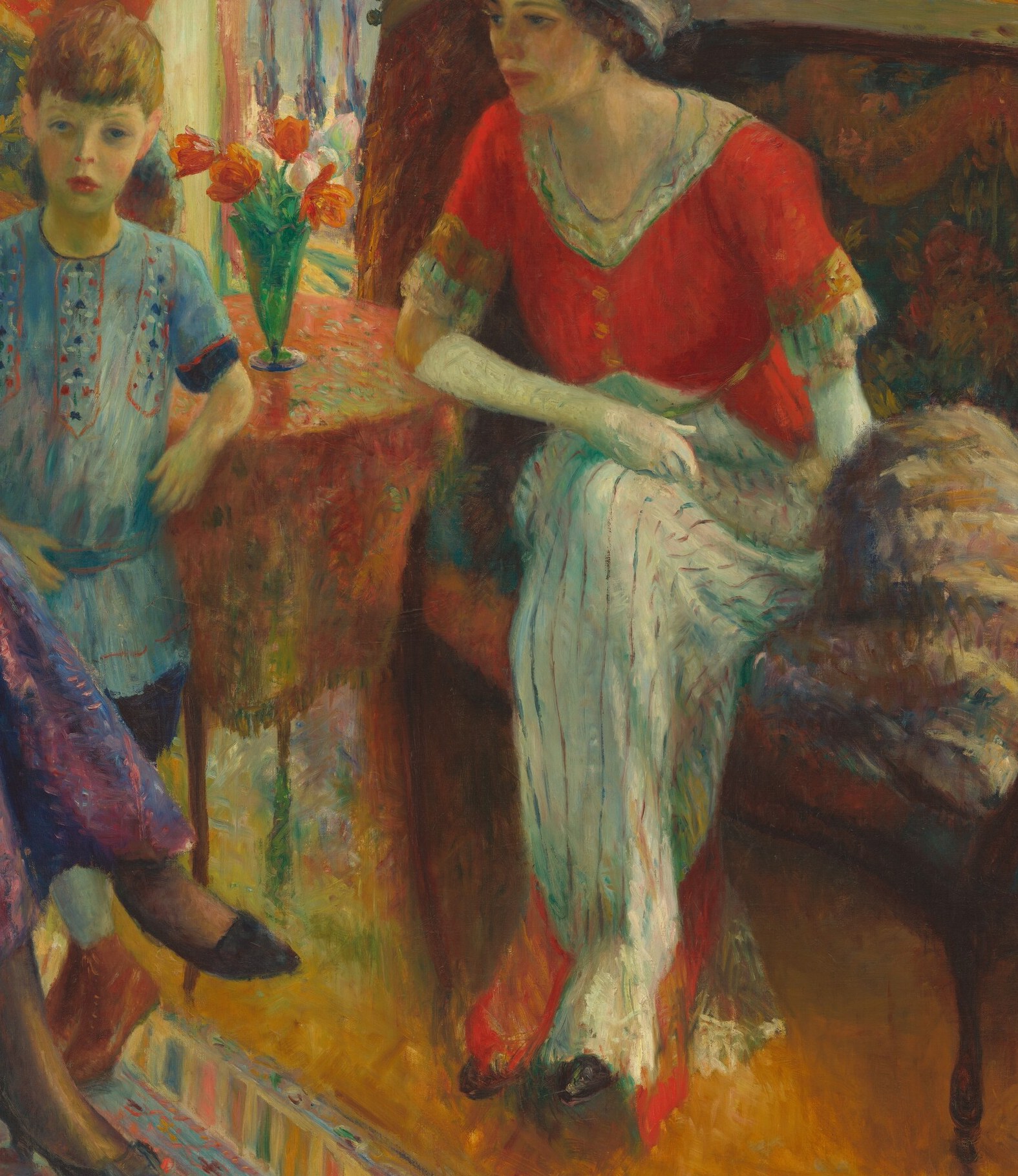 Her tilted hat and averted gaze add a touch of mystery, and the vibrant red of her top contrasts with the softer tones around her.