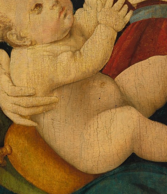 The Christ Child looks up, already aware of his destiny.