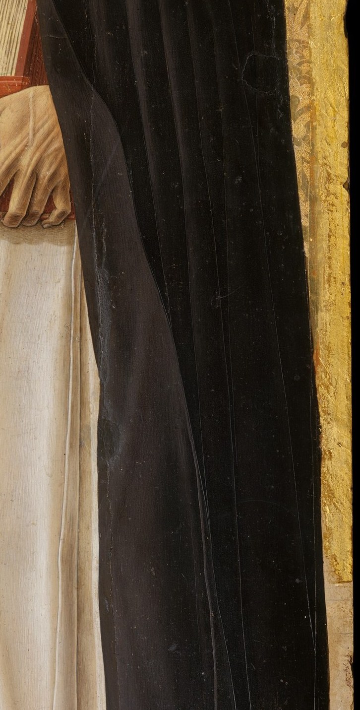 Notice the deep, sculptural folds of his monk's habit.