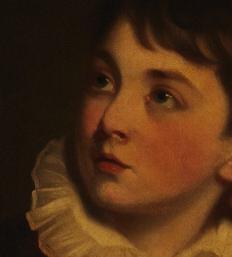 This young man looks away, lost in thought.