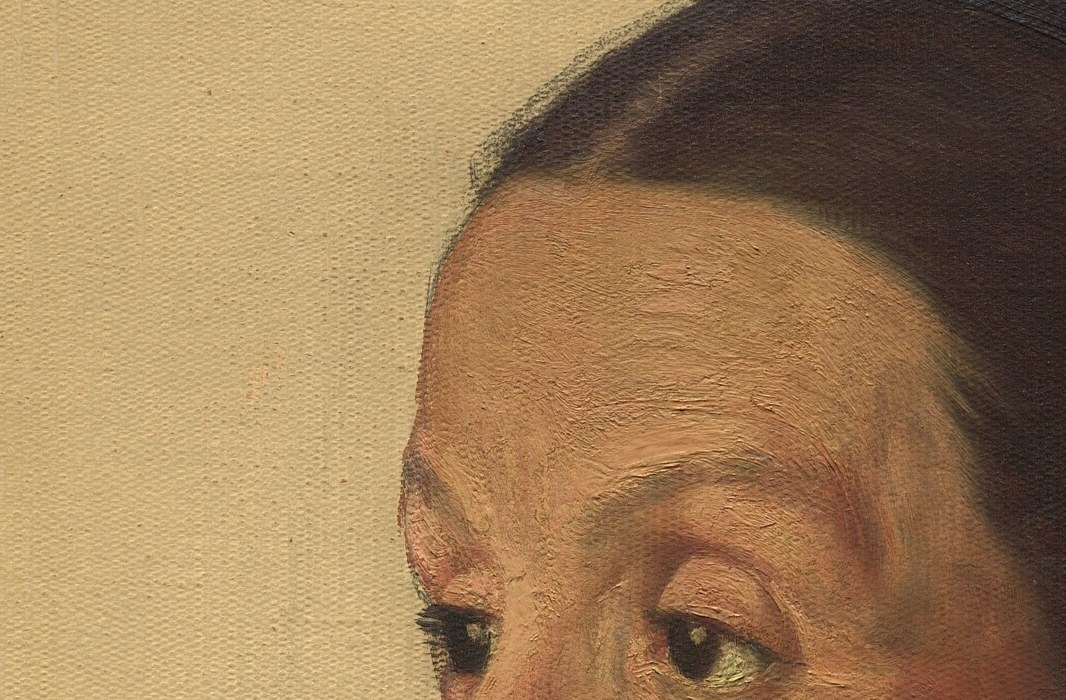 She conveys quiet self-possession, refusing to meet our gaze.