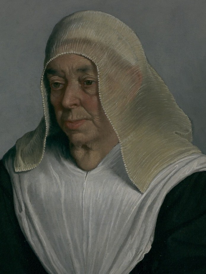 Look at the fine pleats of her veil.