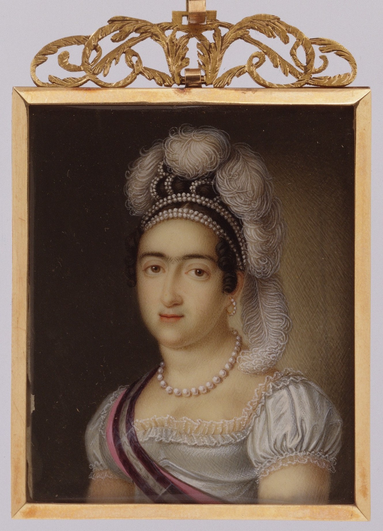 The frame is itself a luxury object , its elaborate chasing signals this was a diplomatic or intimate gift; frame and image together constitute the artifact in a way that canvas portraits never do.