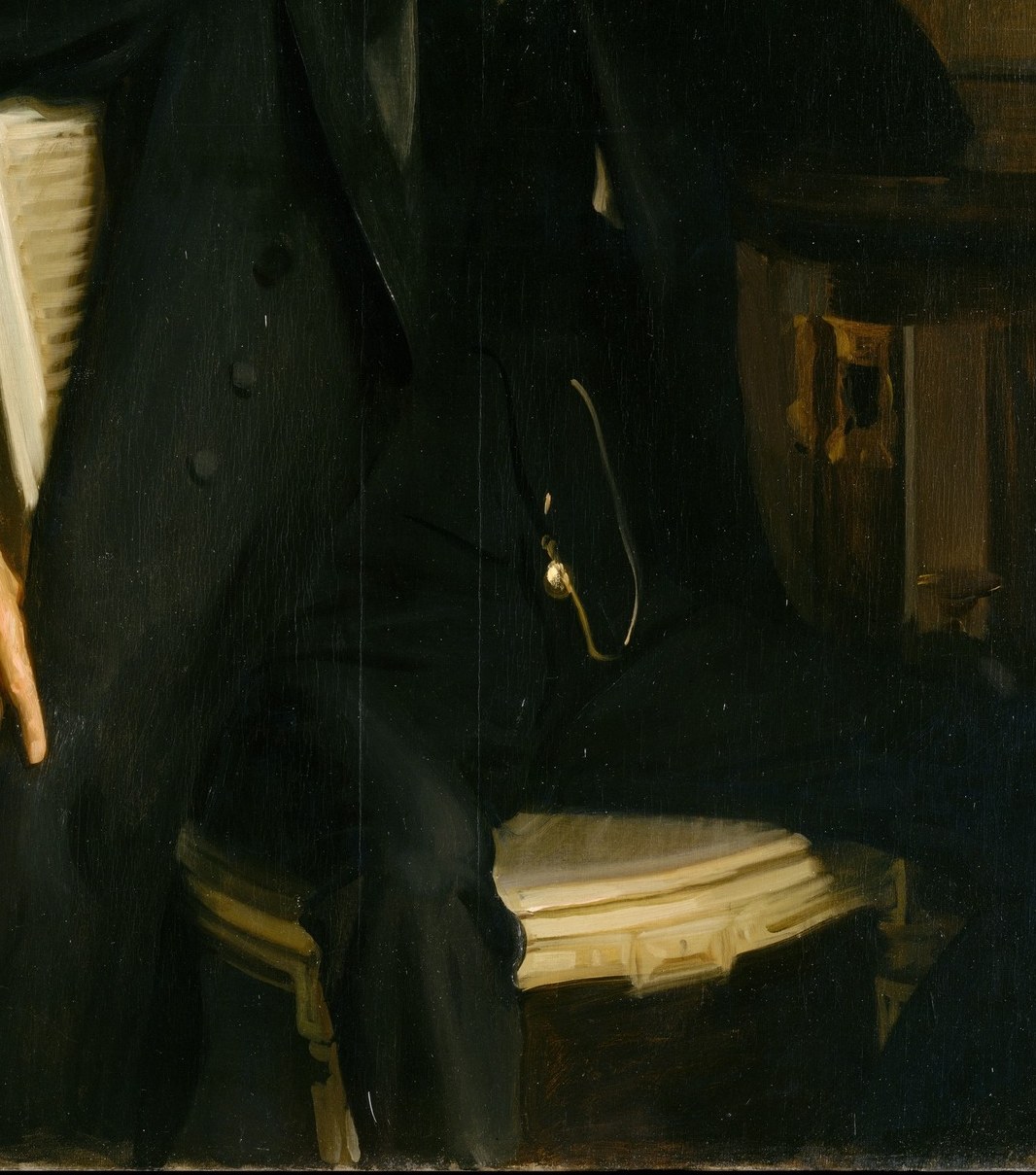 The rich texture of his suit speaks to status.