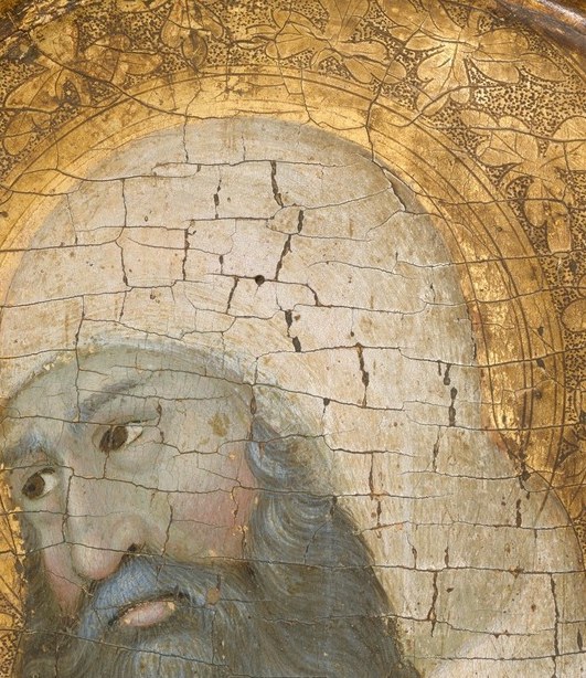 Against every rule of icon painting, he won't meet your gaze.