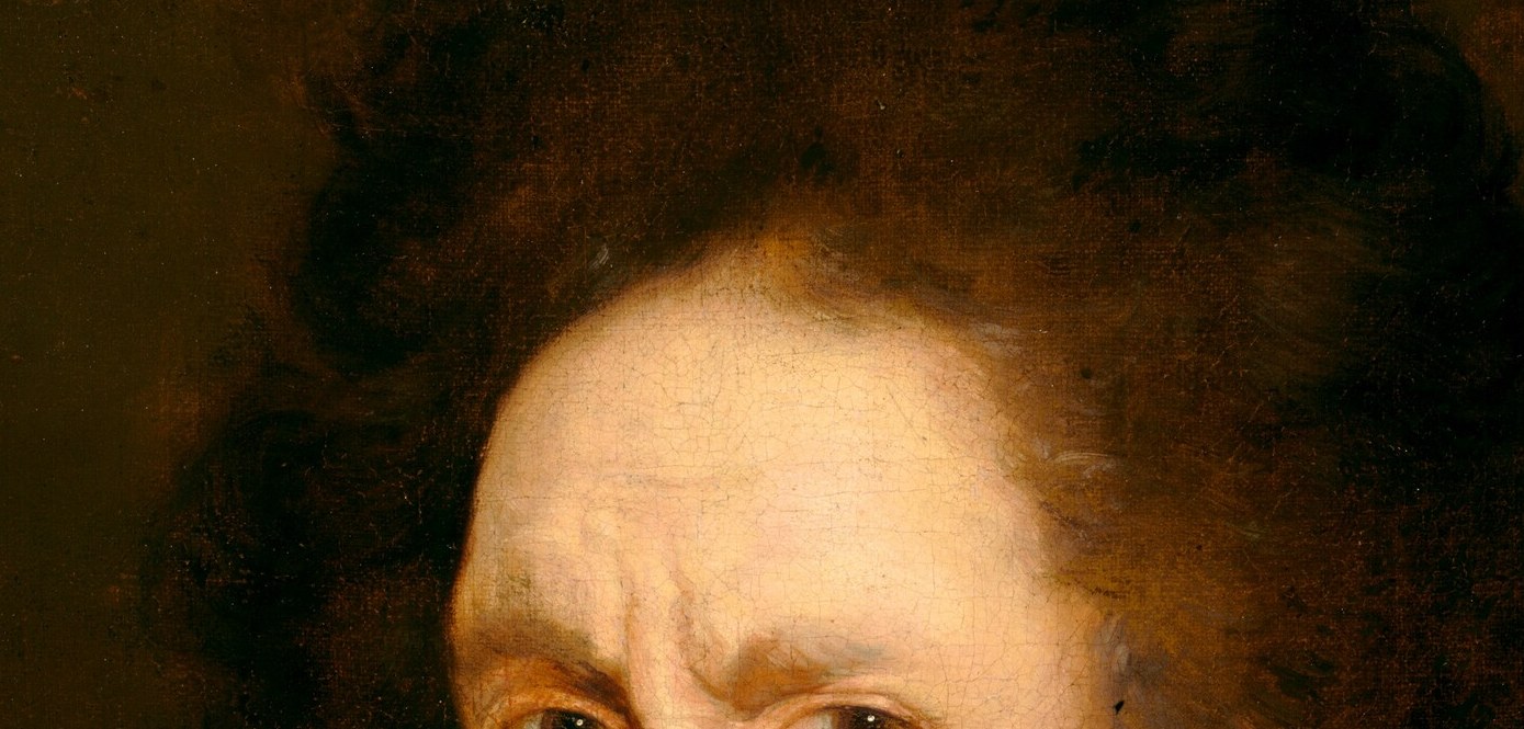 His pale eyes hold a steady, slightly guarded gaze.