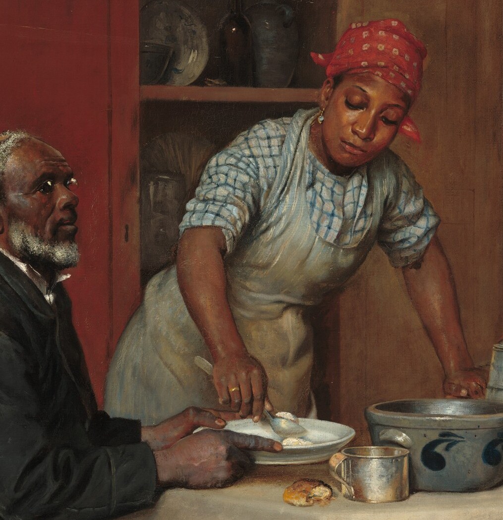 A family shares a quiet meal, perhaps after working all day.