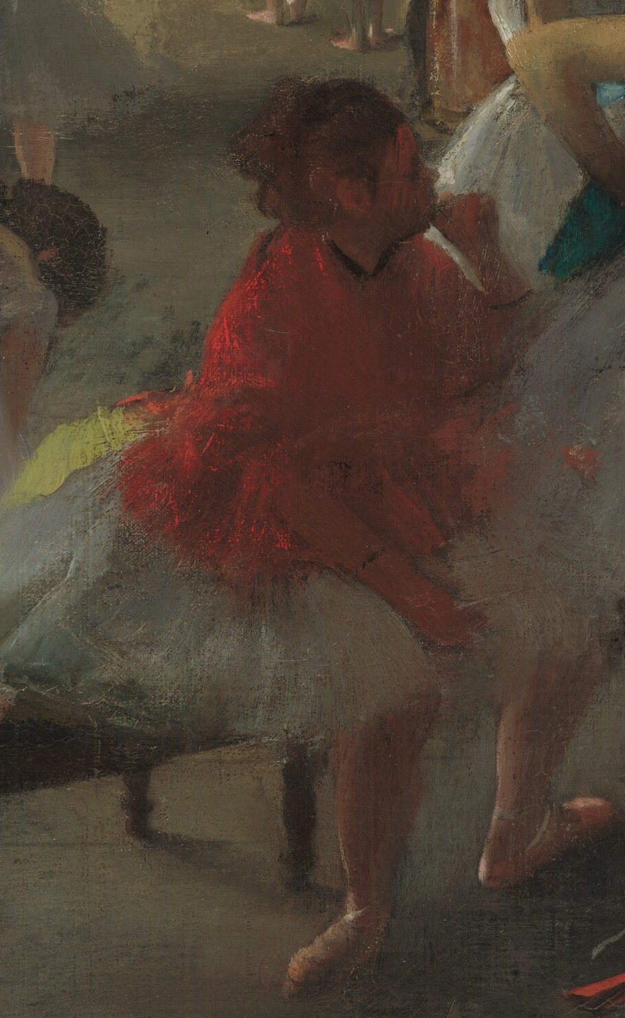 This figure's bright red top draws the eye and suggests a different role or status, perhaps a teacher or more experienced dancer.