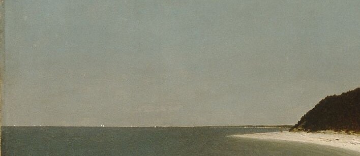 A few small boats rest near the shore.