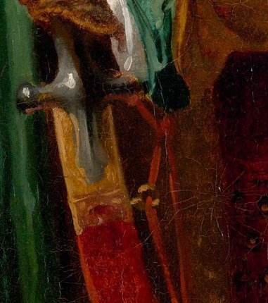 Look at the way he holds the sword.