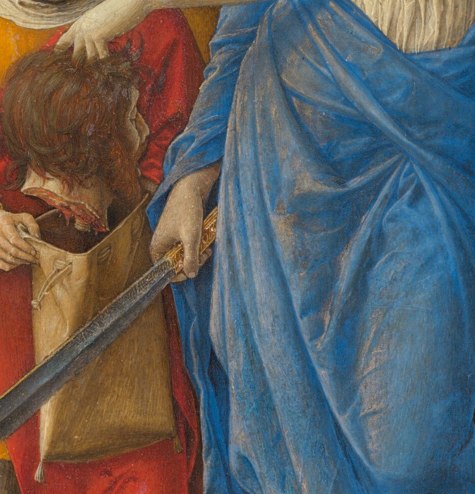 Her hands guide the head into an ordinary cloth sack.