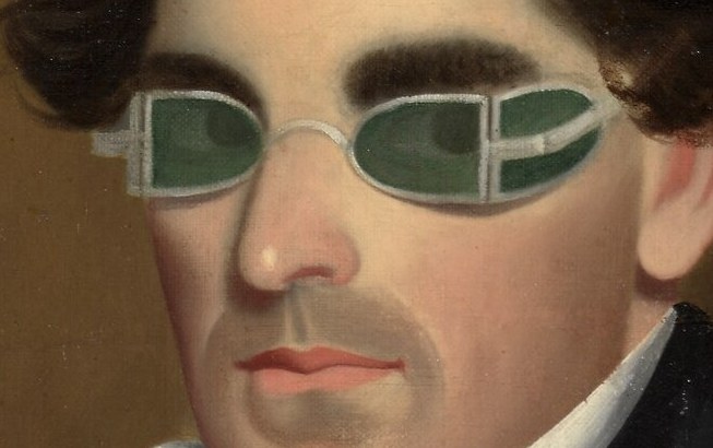 Notice the unusual green-tinted glasses.