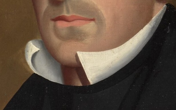 The stark white of the ruff contrasts with his dark attire, drawing attention to his face and neck.
