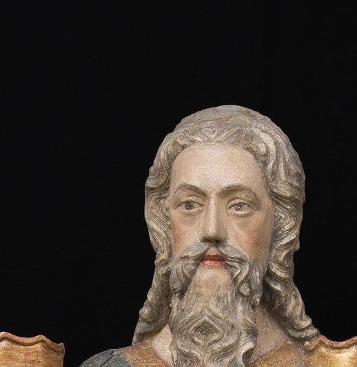 The patriarch's serene authority anchors the entire composition; the long white beard is the primary visual signal of divine seniority in late-medieval iconography.