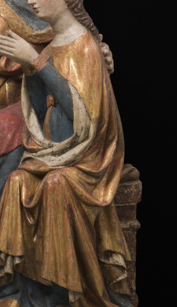 But look closely at her red robe.