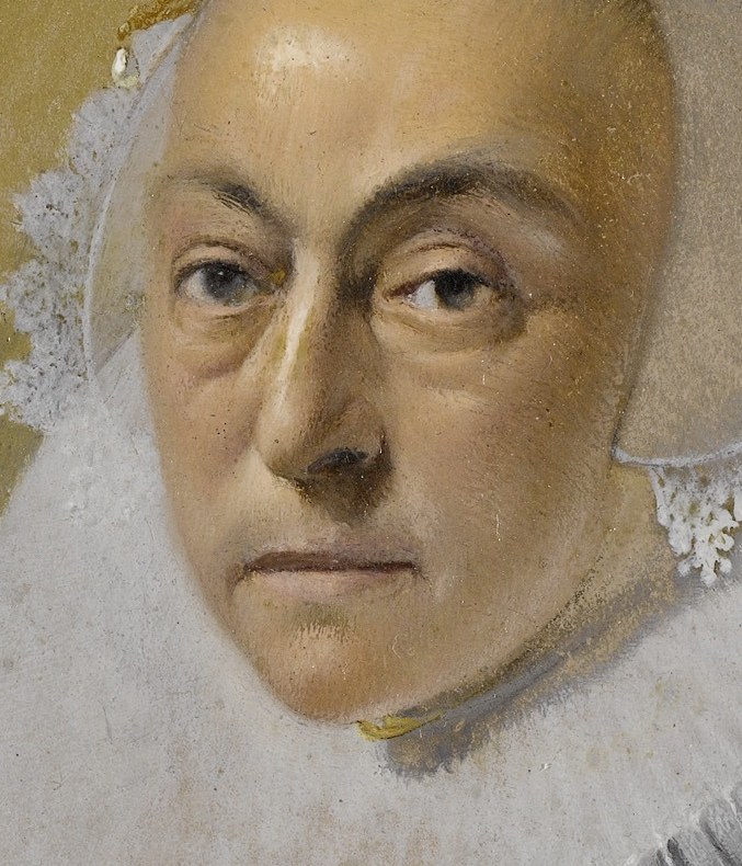 Her direct gaze and subtle expression convey a sense of quiet introspection and dignity.