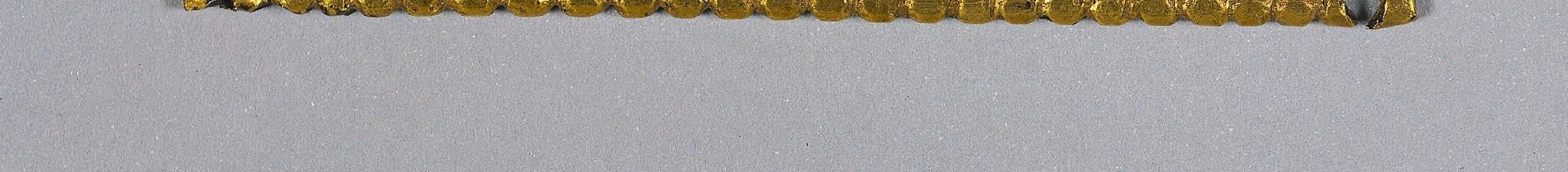 The mirror symmetry of the two border strips enforces a deliberate hierarchical design; the paired bands frame the enamel field like a manuscript ruled line.