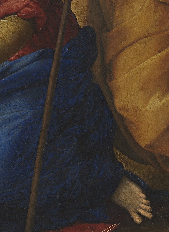 The Christ Child sits playfully on a lamb, symbolizing sacrifice.