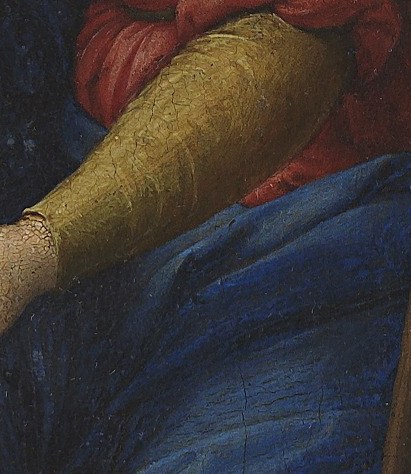 Mary’s hand rests gently on him, a mother’s protective touch.