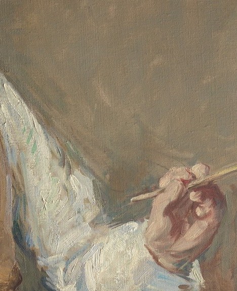 The poised, upraised brush signals a moment of pause or explanation , gesture frozen between action and thought