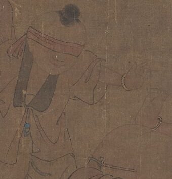 His robes reflect attire from 12th century China.
