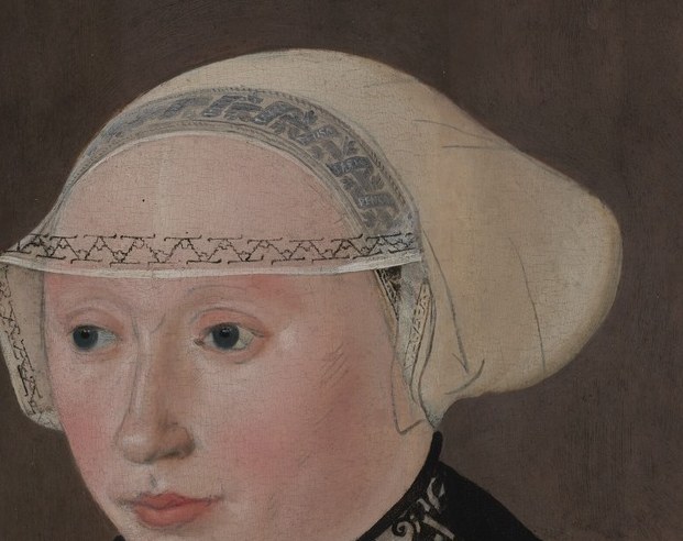 Her lace cap signals modesty and piety.