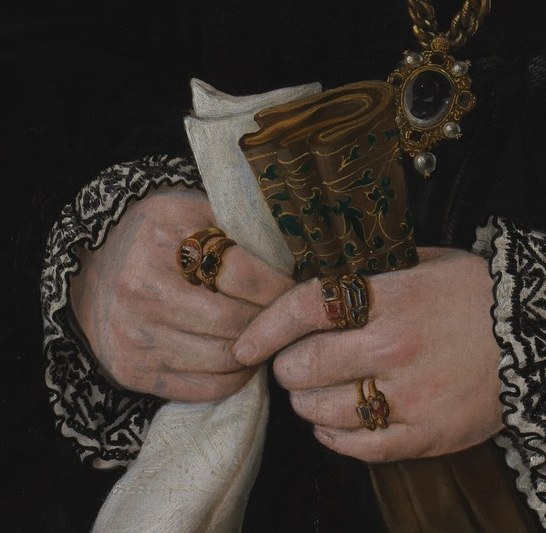 Her hands hold a paper, a hidden message.