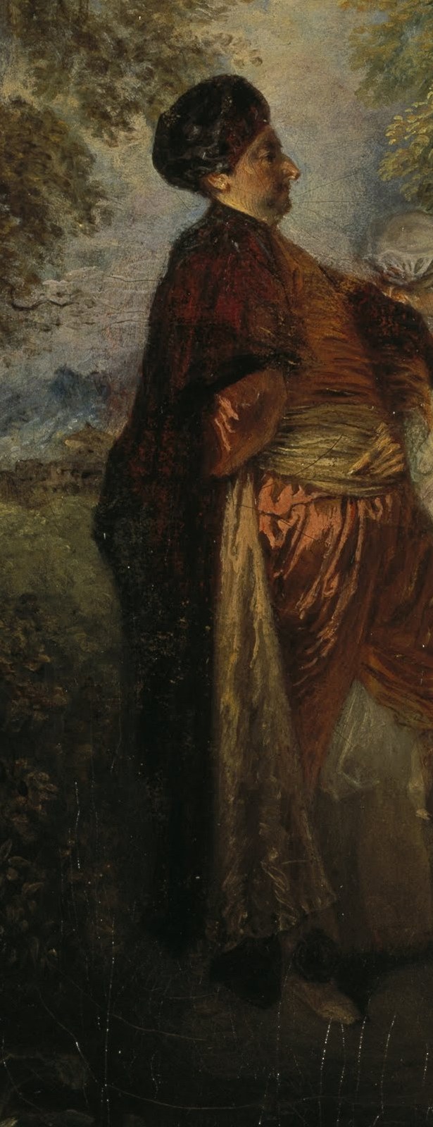 His exotic attire and commanding pose suggest he is a figure of importance, perhaps an observer or host, adding a touch of mystery.