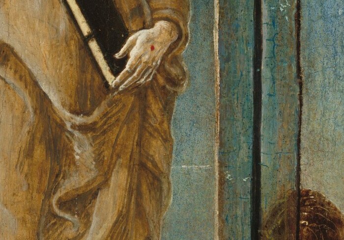 The dark, bound book he holds is a symbol of scripture and learning, grounding his spiritual authority.