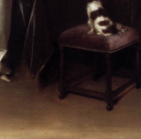 The dog is a fidelity symbol common in Dutch genre painting; its quiet presence at the letter-writer's feet reinforces themes of loyalty and secrecy within the domestic sphere.