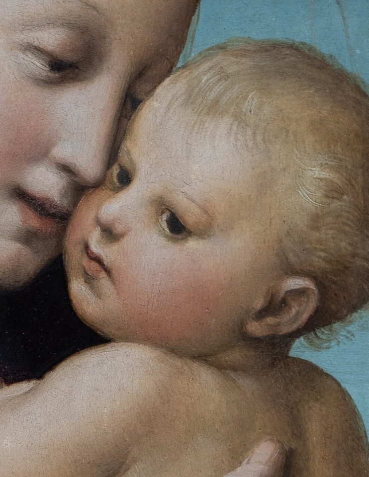 His bright, alert eyes and cherubic features capture the innocence and divine nature of the child.