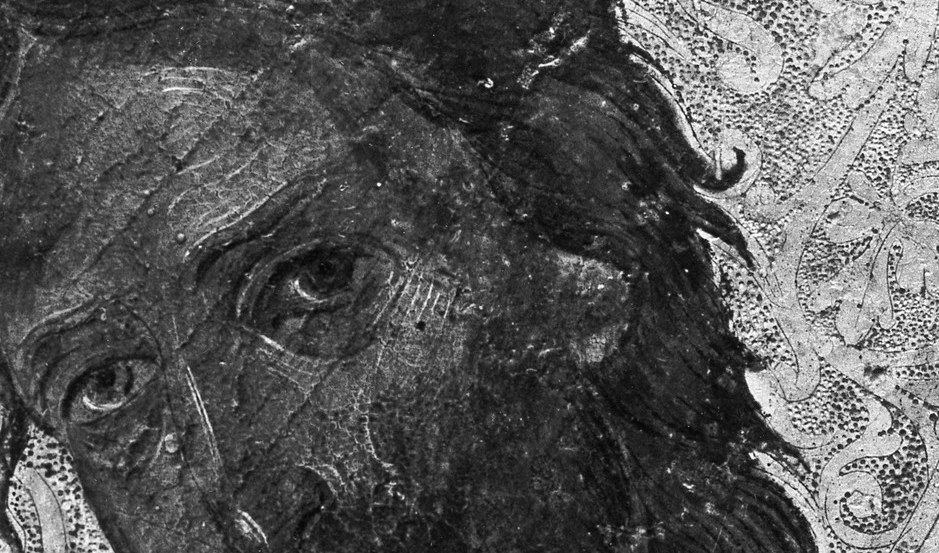 The unruly, dark hair adds to the saint's rugged appearance and spiritual intensity.