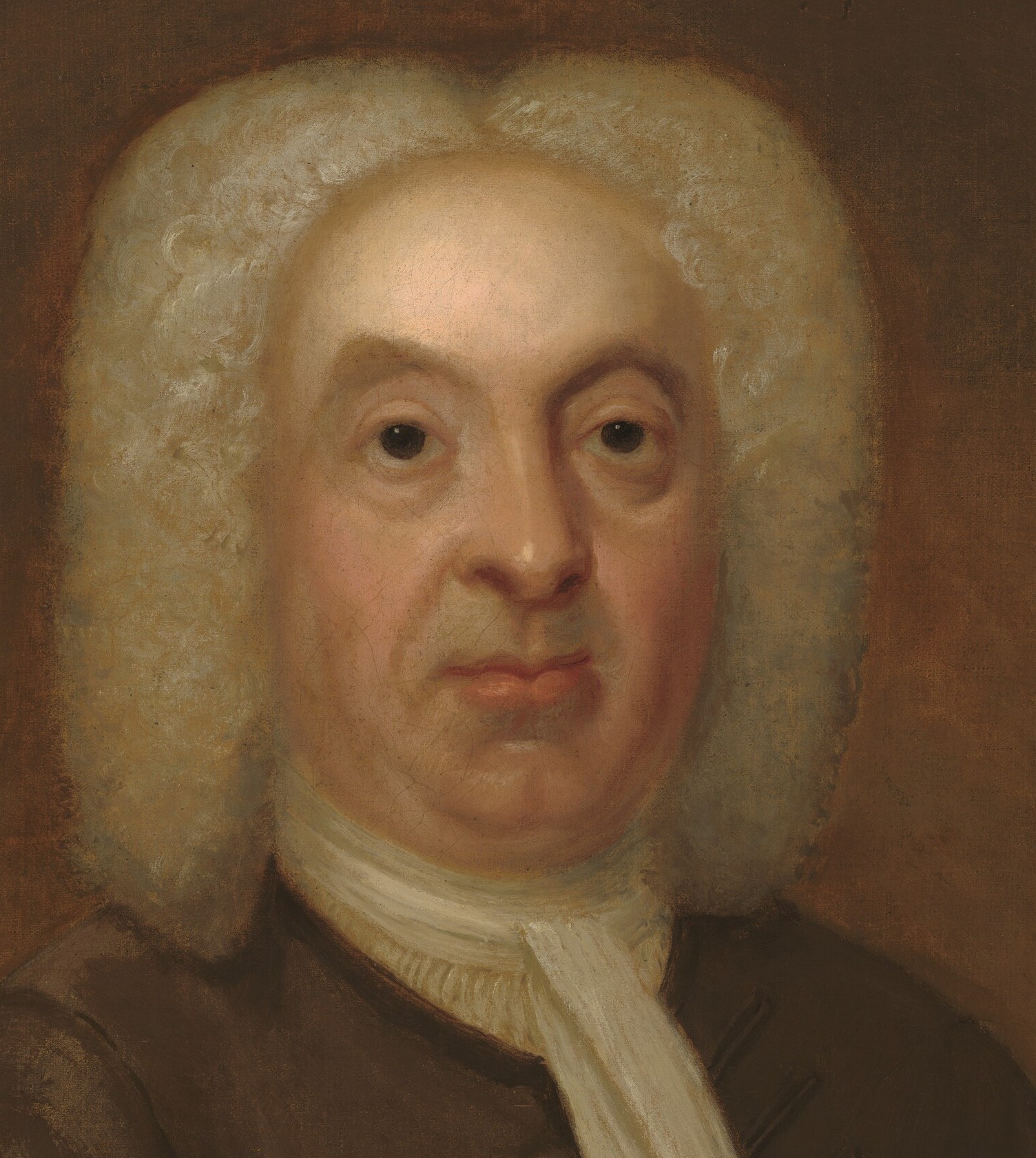 The full-bottomed white wig is the most immediate status symbol in the frame, announcing the sitter as a man of rank and wealth in early 18th-century Britain.