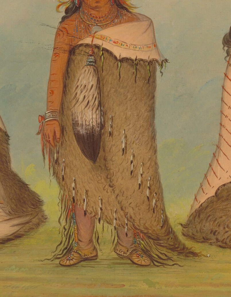 The texture of the fur and the intricate fringe suggest craftsmanship and cultural identity.
