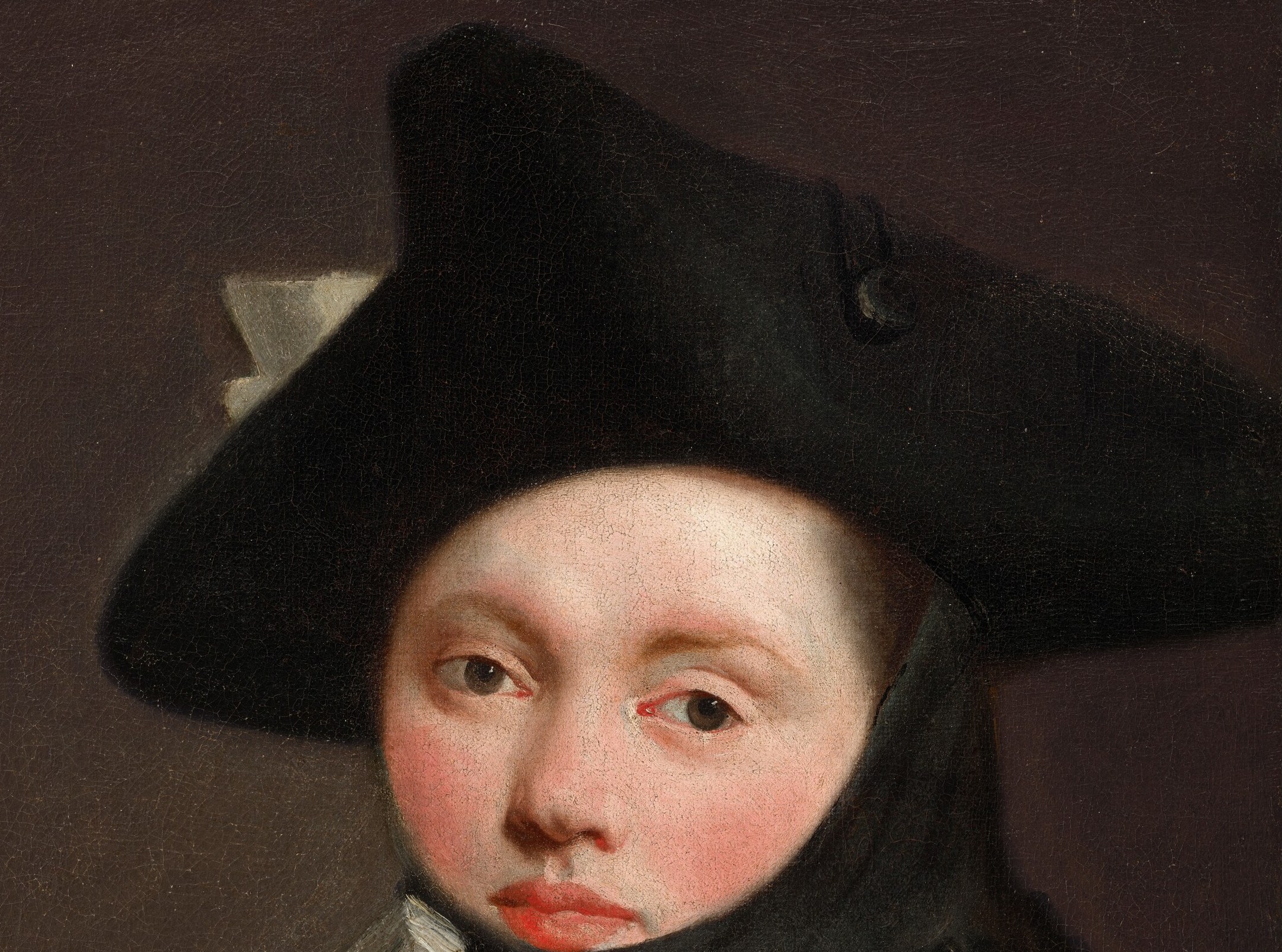 She wears a tricorn hat, a mark of current fashion.