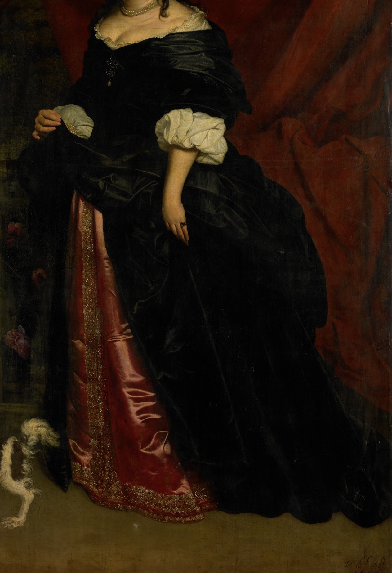 See the heavy folds in her black gown.