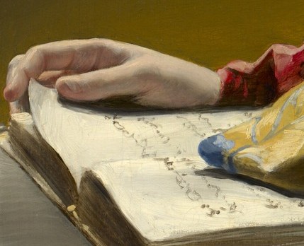 Her hand rests on an open book.