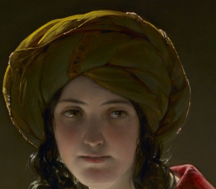 Her costume suggests an Eastern identity.