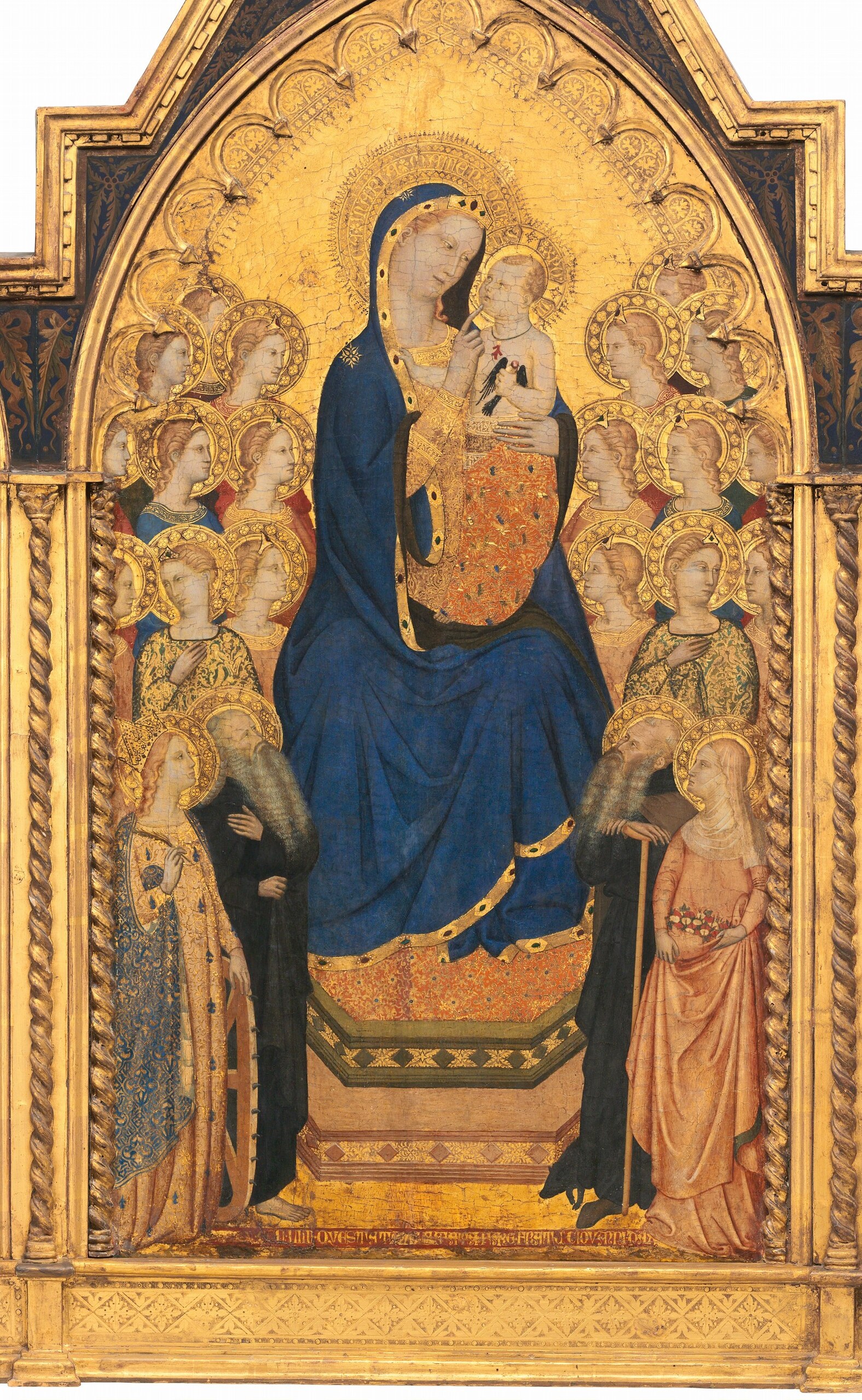 The shimmering gold leaf creates a non-representational, divine space, elevating the figures beyond earthly reality.