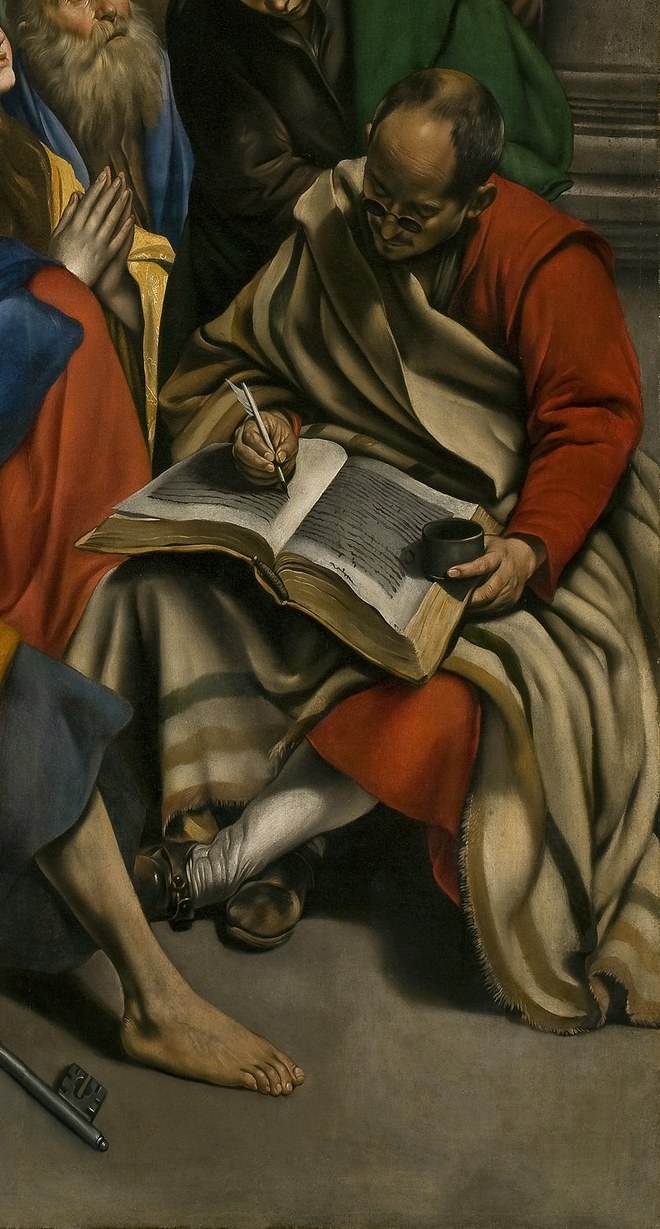 One man writes, recording the divine revelation.