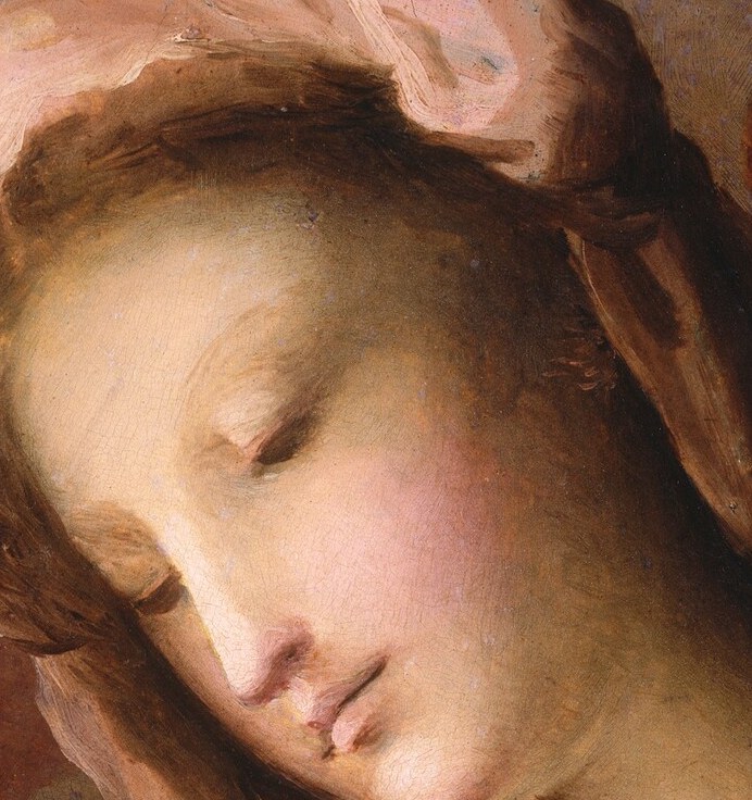 See the delicate folds of her pink veil, barely there.