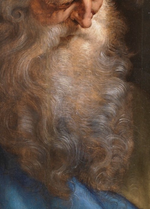 The texture and volume of the beard add to the figure's gravitas and age.
