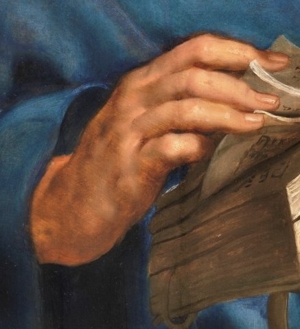 And a powerful hand grips this open book.