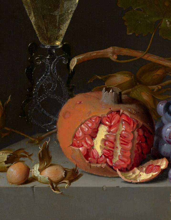 The compositional anchor: the dramatic cut reveals a cavity of glistening red arils, combining symbolic weight (fertility, mortality, the Passion) with a painterly challenge of rendering wet organic surfaces.