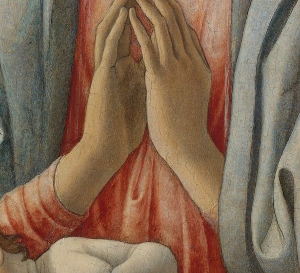 She doesn't hold the child. She prays over him.