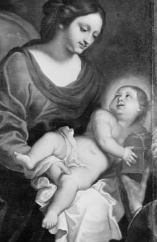 A mother holds her sleeping child close.