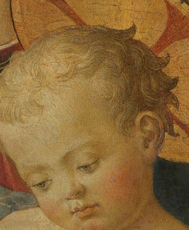 His small hands reach out, seeking comfort.