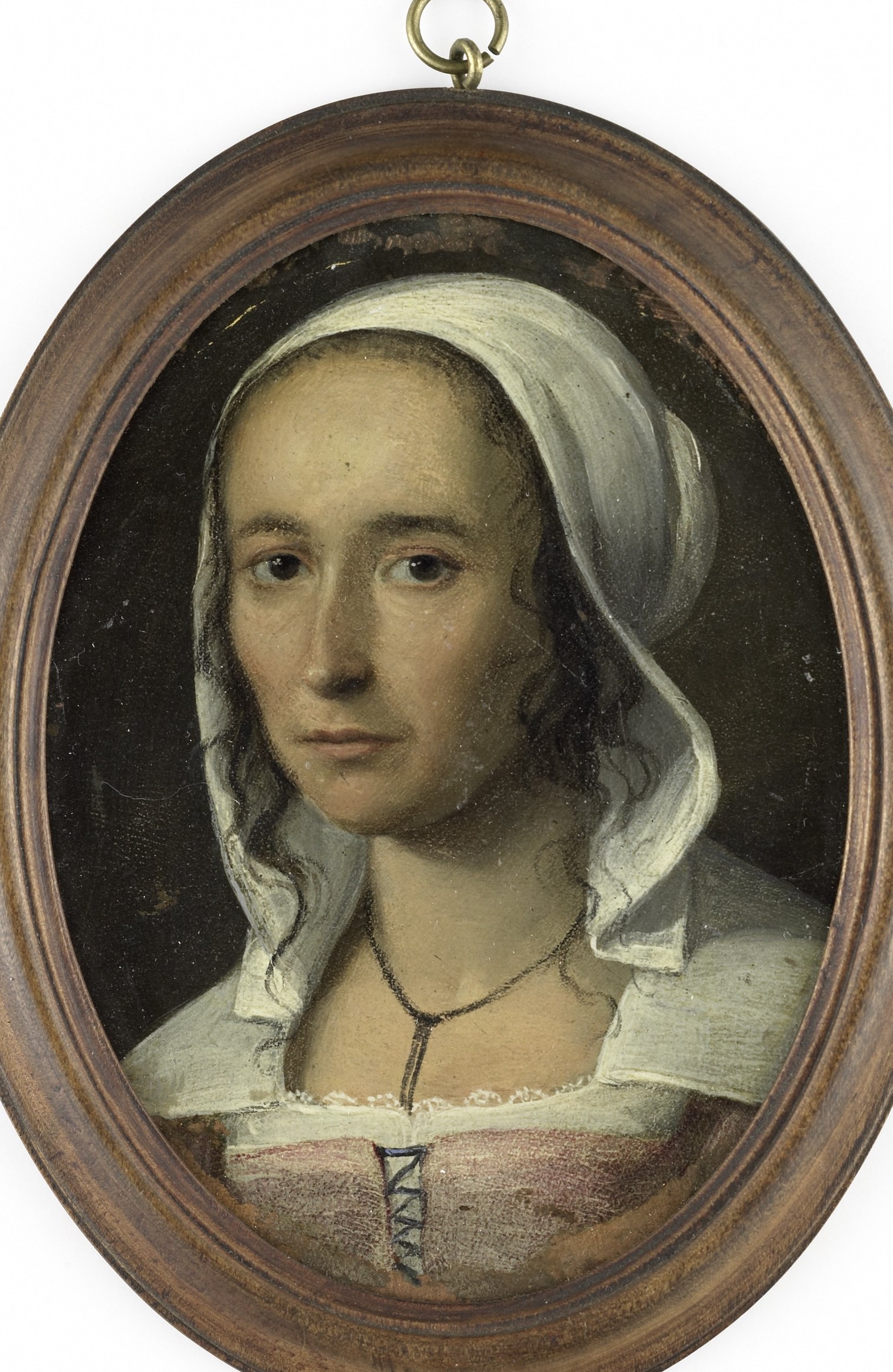 The warm, dark wood of the frame encloses the portrait, giving it a sense of preciousness and antiquity.