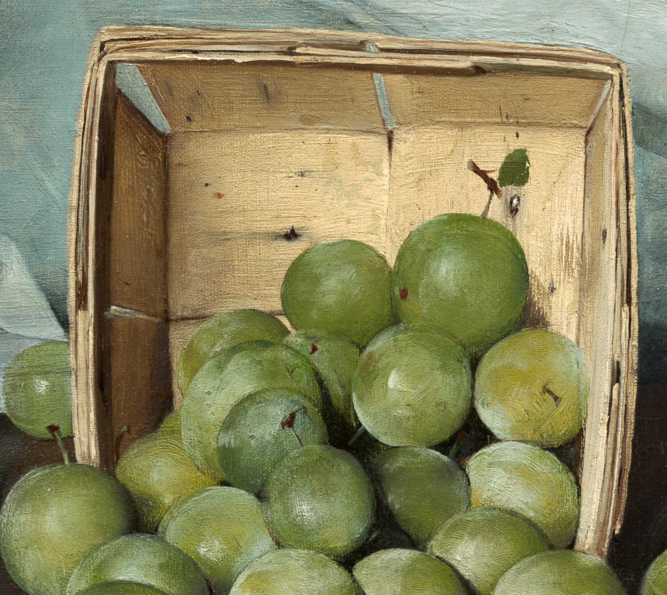 The rough texture of the wood contrasts with the smooth fruit, grounding the composition.